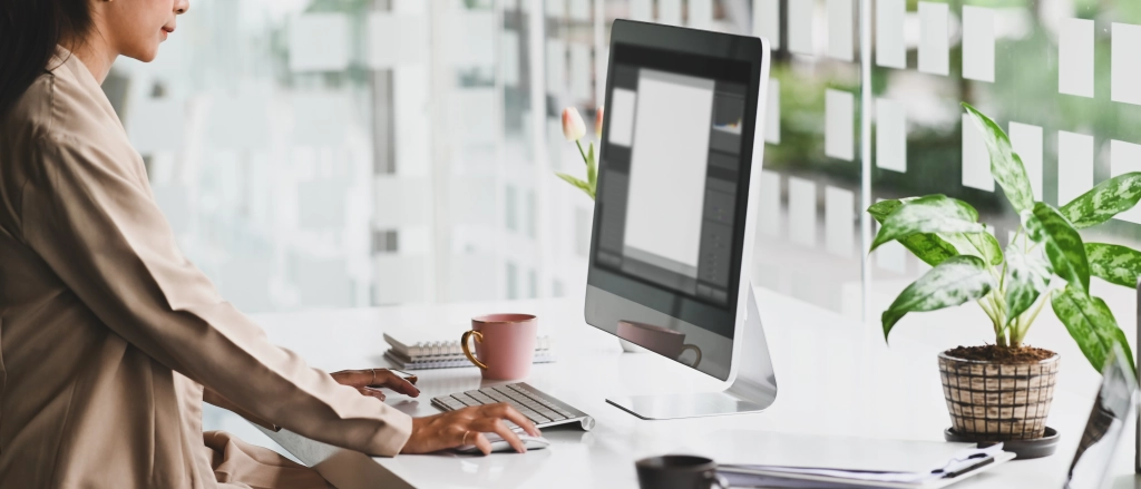 person at computer getting artwork ready for print