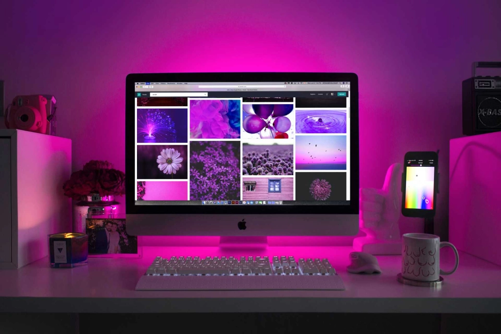 Purple image of imac with photos on the screen