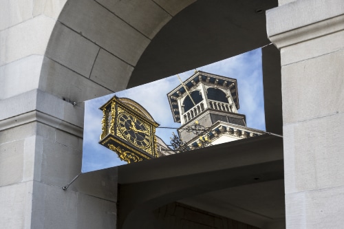 outdoor banner with a picutue of Guildfords historic clock on it.