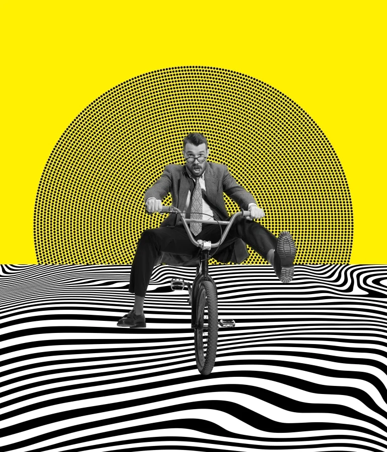 Entrepreneur on a bicycle in a black and white landscape