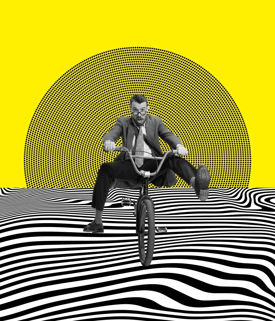 Entrepreneur on a bicycle in a black and white landscape