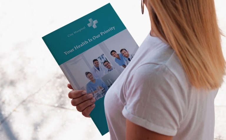 healthcare professional holding a medical brochure