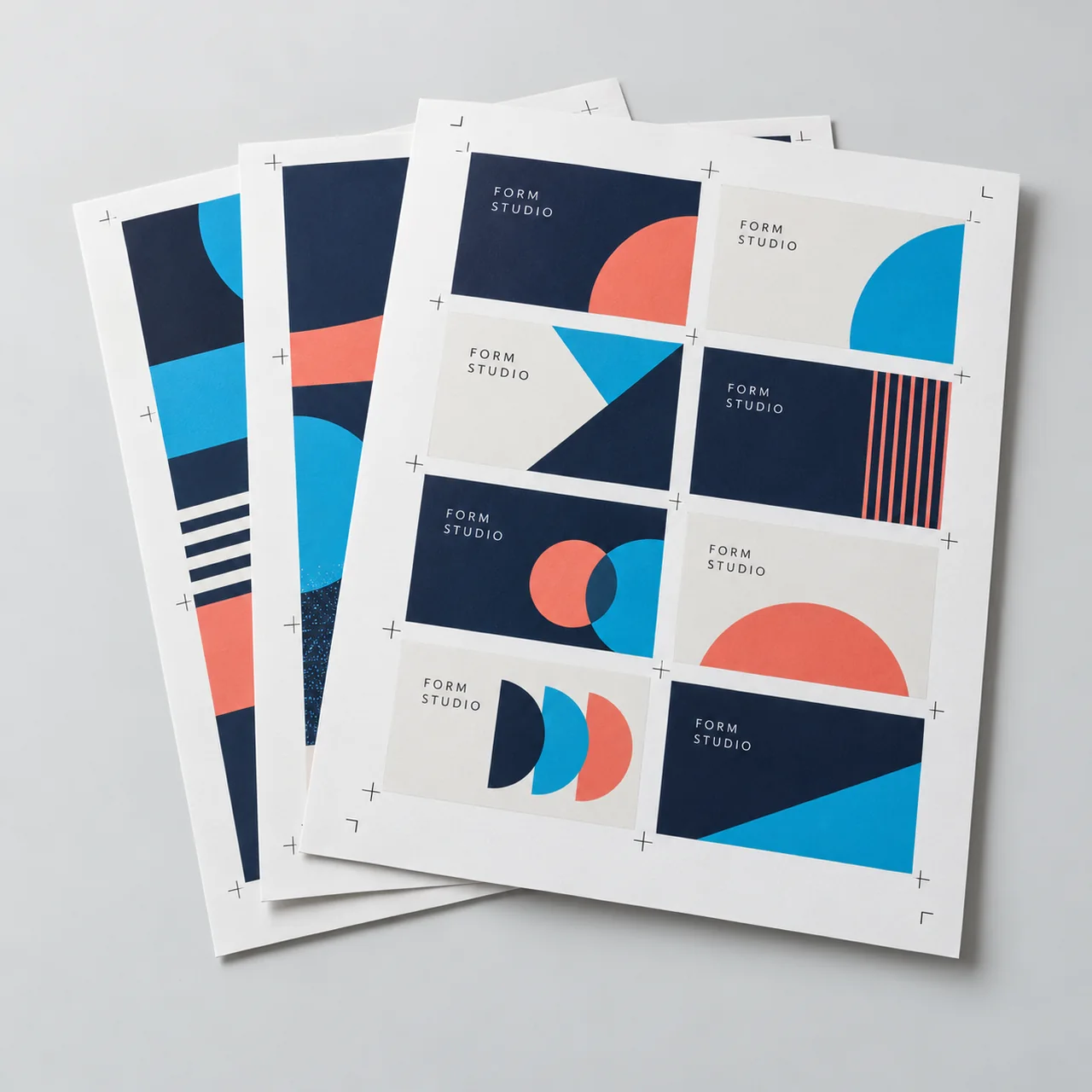 Illustration of uncut printed sheets with several card designs and crop marks.