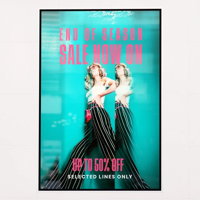 A colourful printed backlit poster in a retail lightbox; the frame and lighting are not included.