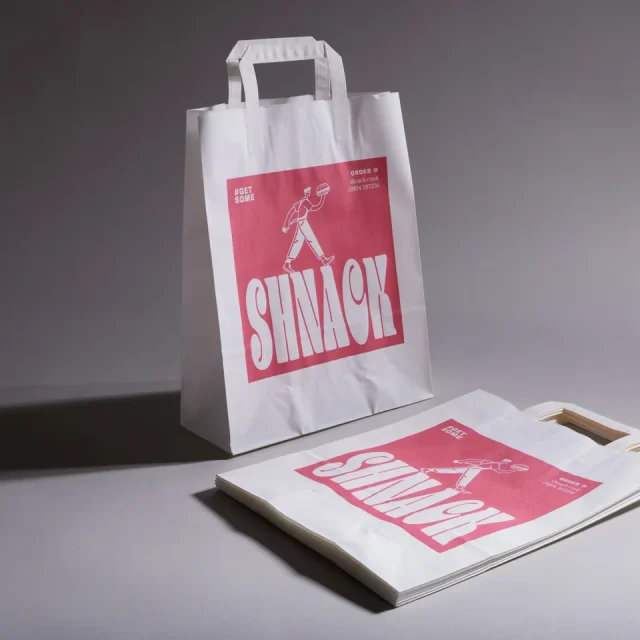 White kraft paper bag with flat handles and a single-face example design